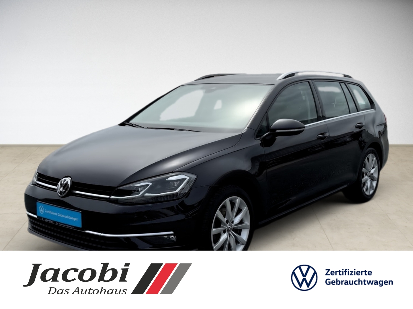 Schwarzer Volkswagen Kombi, seitlich, auf hellem Boden, mit Logos von Jacobi und Volkswagen.
