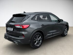 Dunkelgrauer SUV mit glänzenden schwarzen Details, moderner Look, Rückansicht im weißen Raum.